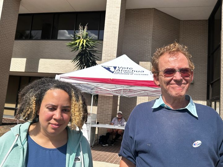 Photo of GOC Members Susan and Tom at an Early Voting site in Alachua County